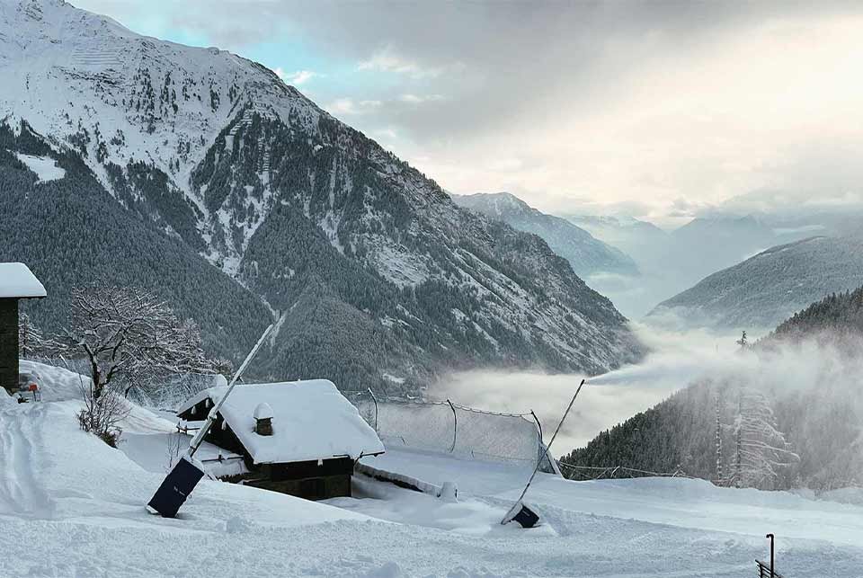 snow cannons blowing artificial snow on a mountain