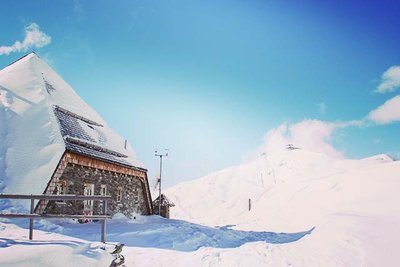 Hut on a snowy mountain