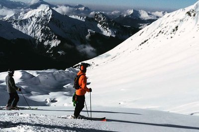 Skier standing on an off-piste slopes