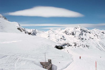 Unusual cloud formation over a snowy valley